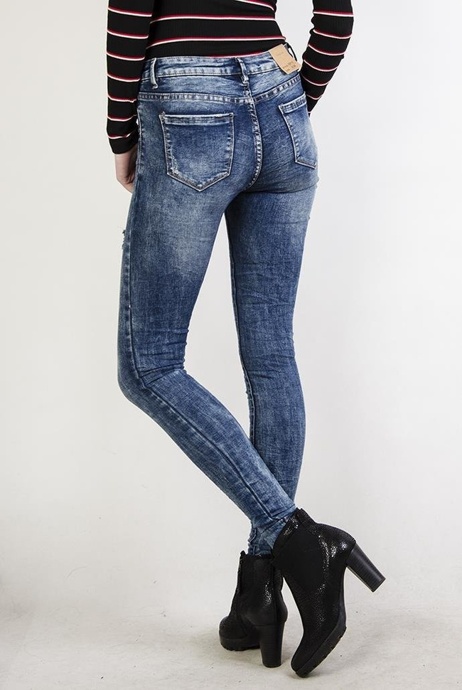 Spodnie jeansowe z zamkami, pogniecione przy nogawkach