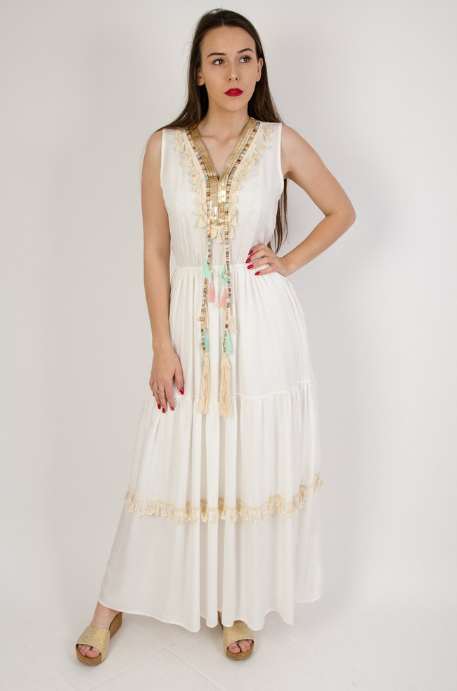 Długa sukienka ze złotymi cekinami obszyta pastelowymi frędzlami