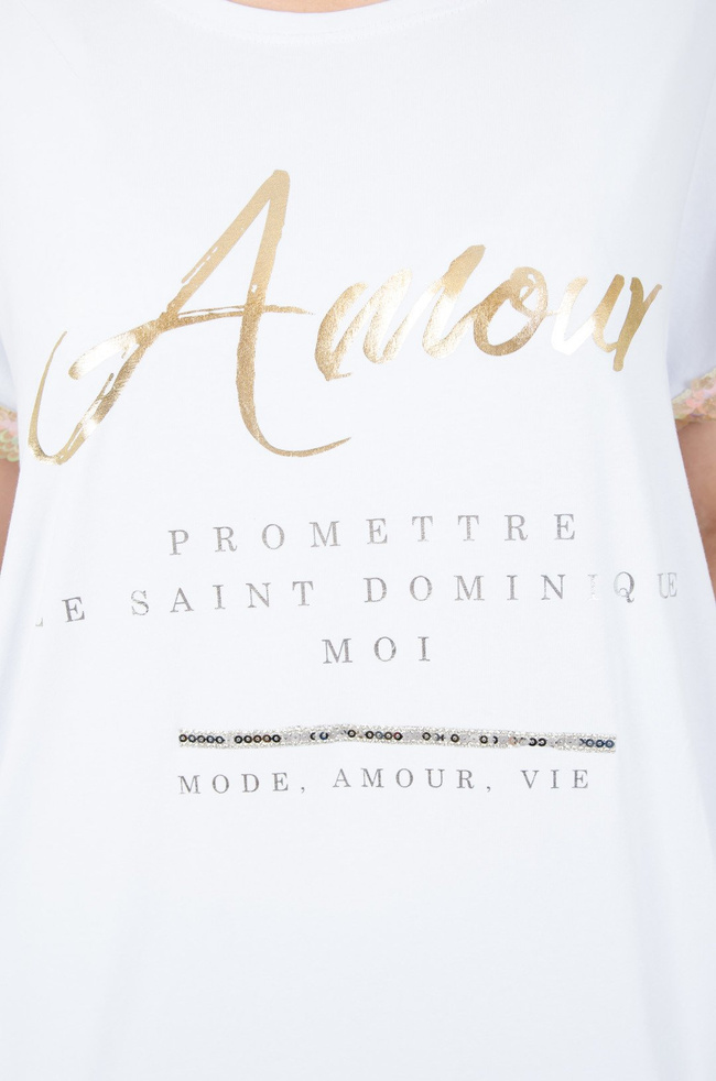 Biała tunika ze złotym napisem i cekinami na rękawie