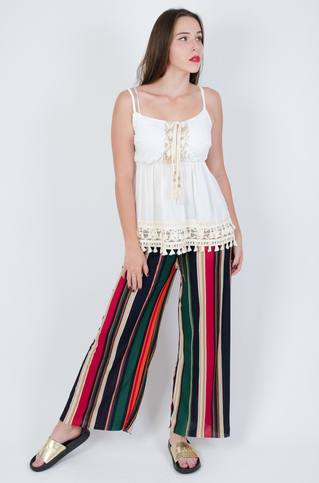 Kolorowe spodnie w paski z rozszerzanymi nogawkami