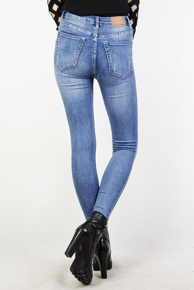 Jeansowe spodnie skinny jeans z przetarciami oraz wysokim stanem