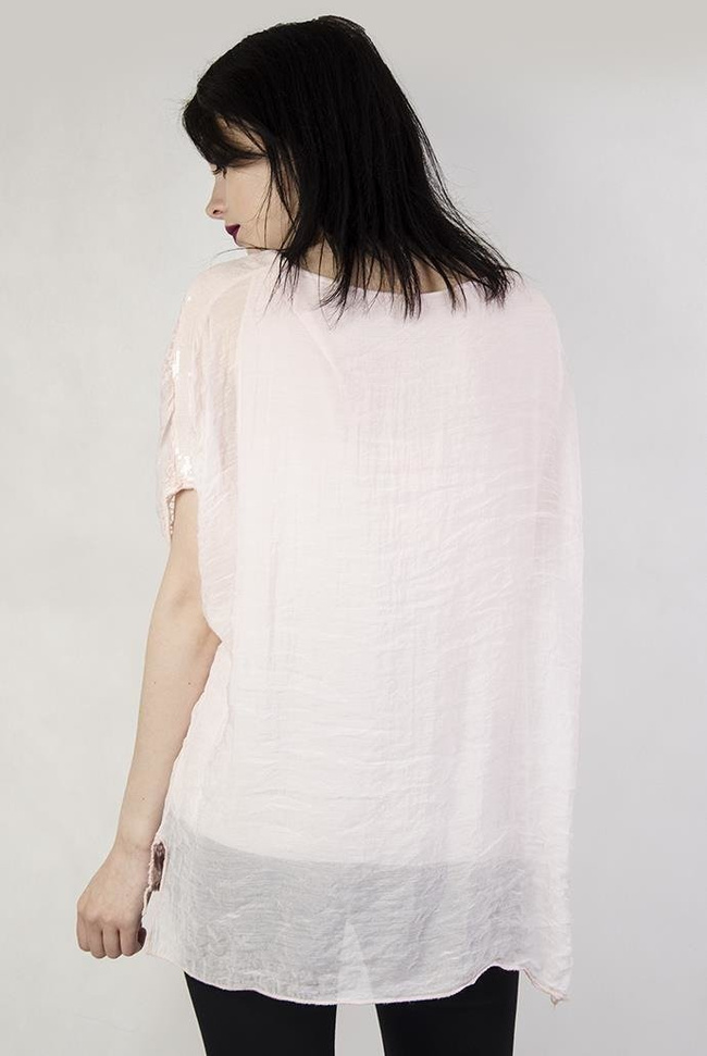 Jasnoróżowa bluzka z haftowanymi kółeczkami