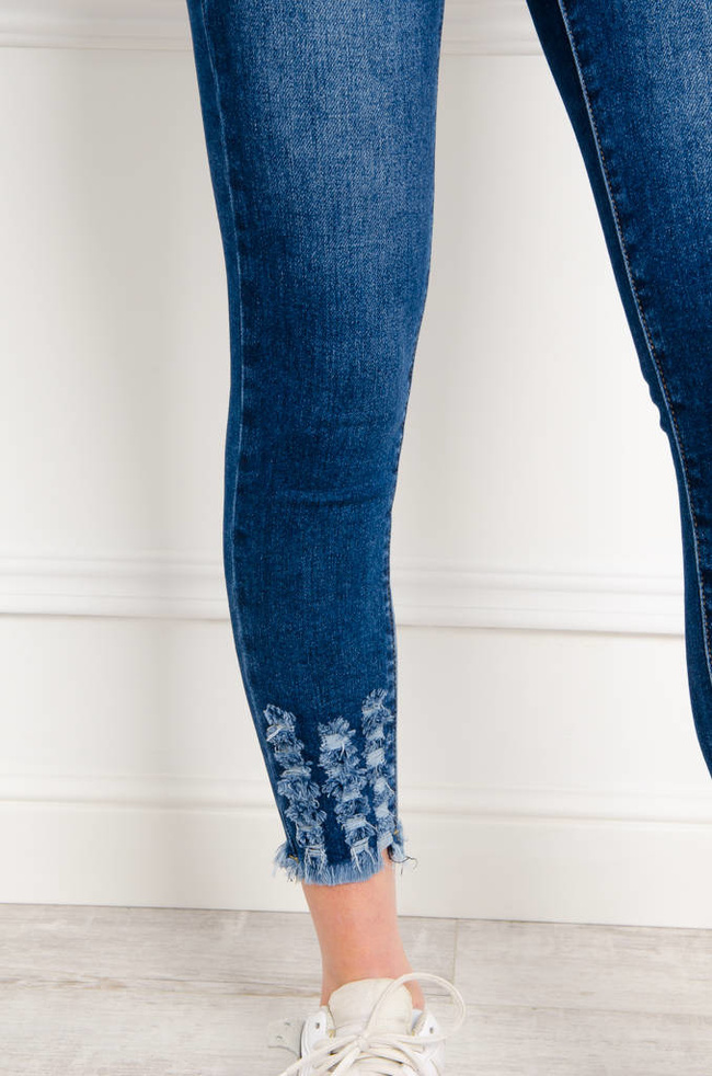 SPODNIE JEANSOWE SKINNY Z PRZETARCIAMI NA DOLE NOGAWKI
