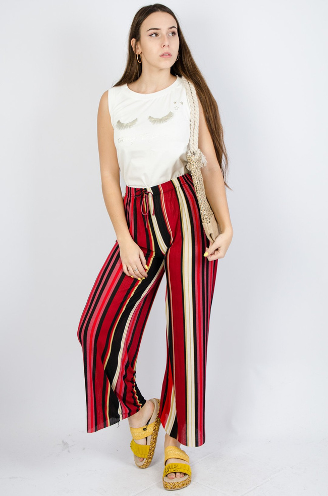 Kolorowe spodnie w paski z rozszerzanymi nogawkami