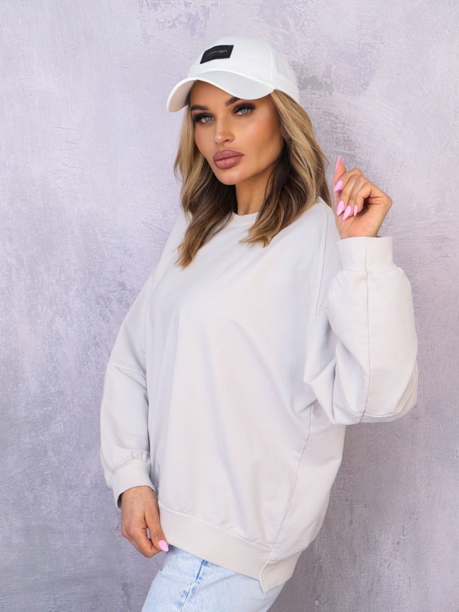 ASYMETRYCZNA BLUZA OVERSIZE Z PRZESZYCIAMI NA RĘKAWACH- BEŻOWA