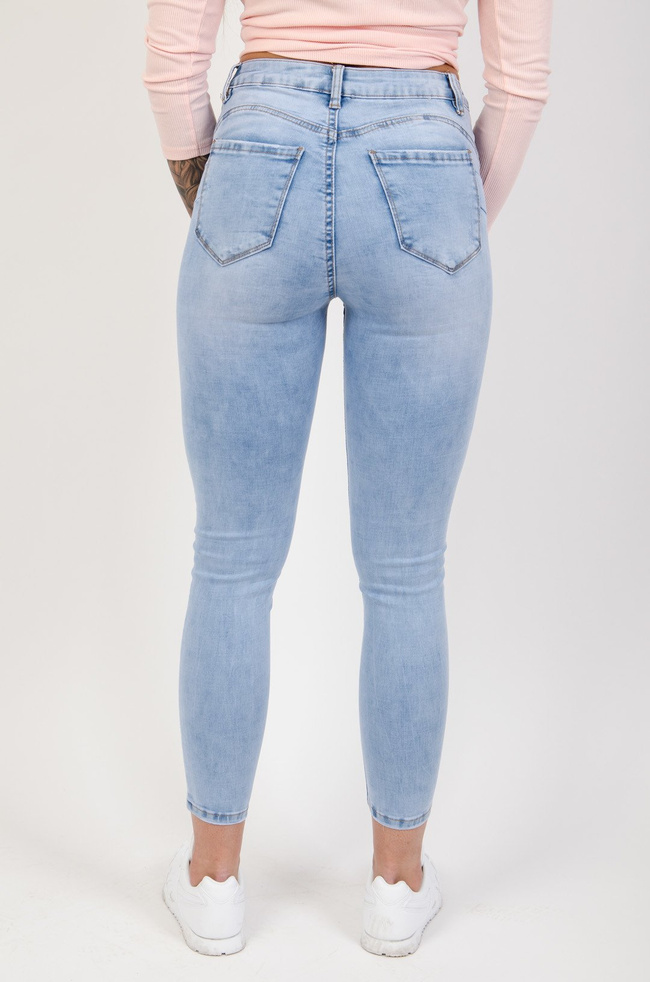 Jasne spodnie jeansowe push up z delikatnymi przetarciami