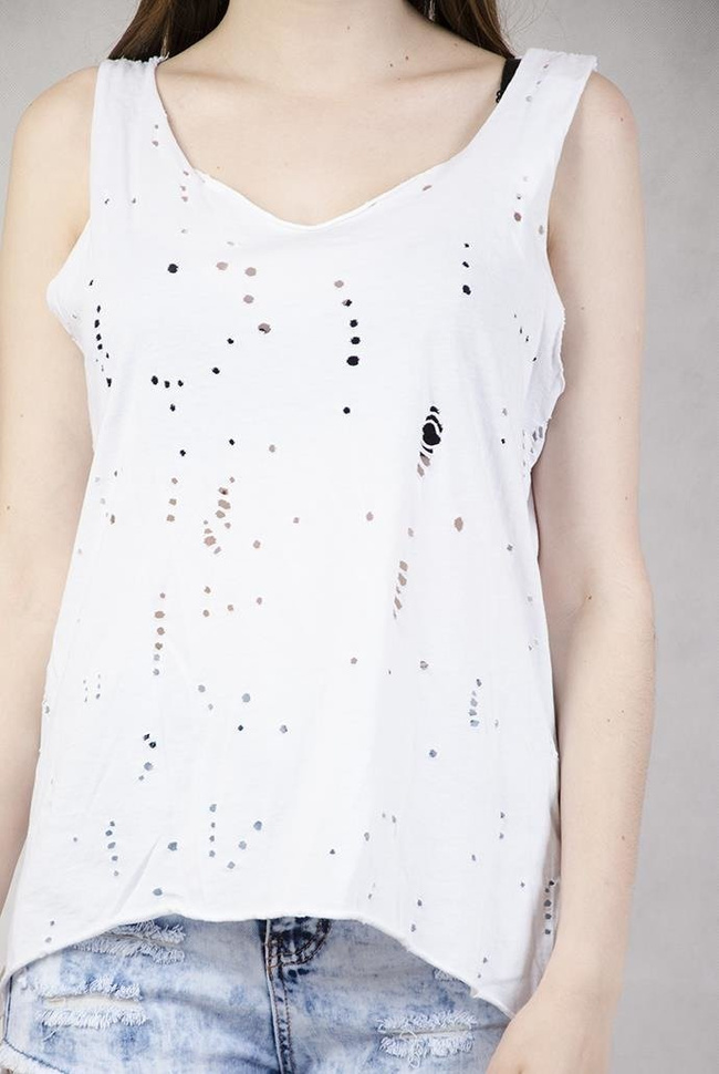 Bluzka z dziurkami i przedłużanym tyłem biała