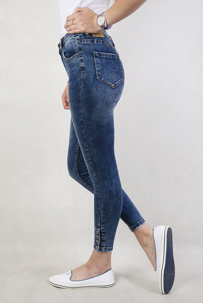 Spodnie jeansowe z wysokim stanem i zatrzaskami przy nogawce