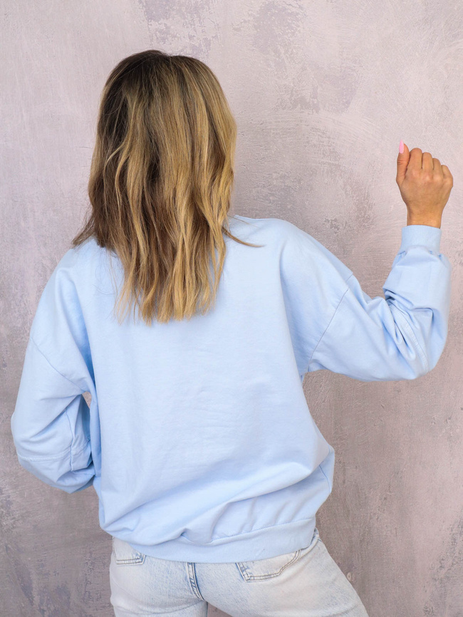 ASYMETRYCZNA BLUZA OVERSIZE Z PRZESZYCIAMI NA RĘKAWACH- NIEBIESKA