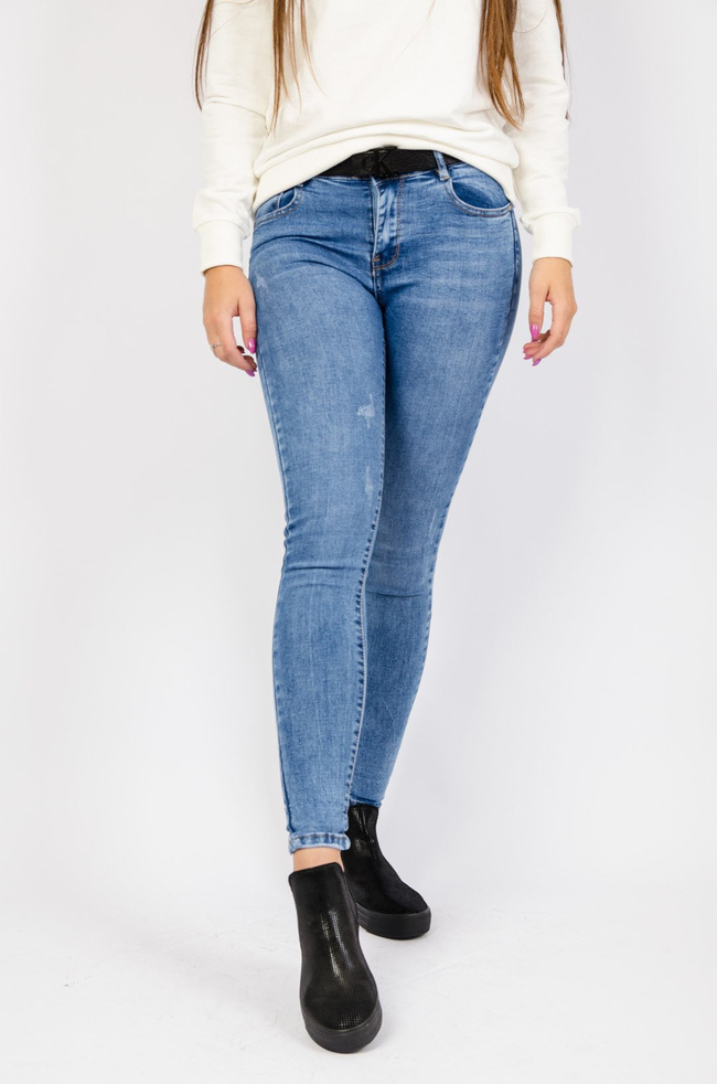 Jasne spodnie jeansowe z przetarciami