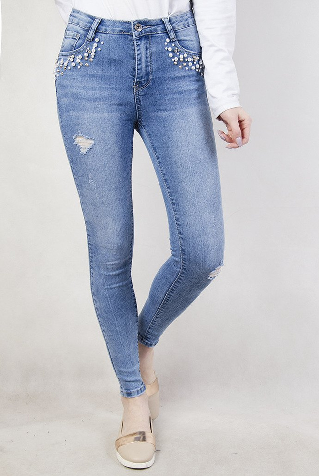 Jasne spodnie z koralikami przy kieszeni