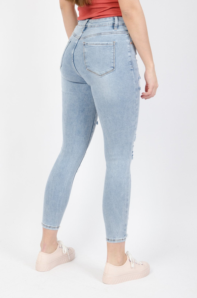 Jasne spodnie jeansowe z przetarciami-wysoki stan