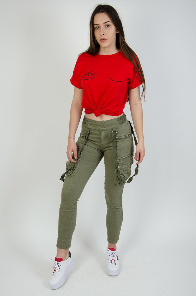 Jasno zielone spodnie joggery z zamkami oraz szelkami