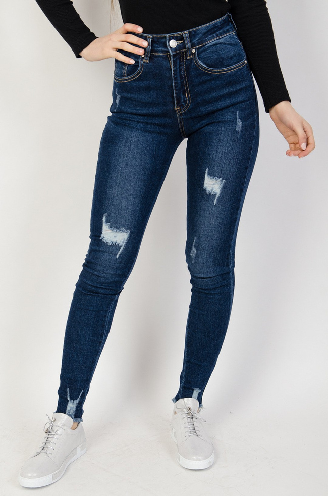 Granatowe spodnie jeansowe z przetarciami