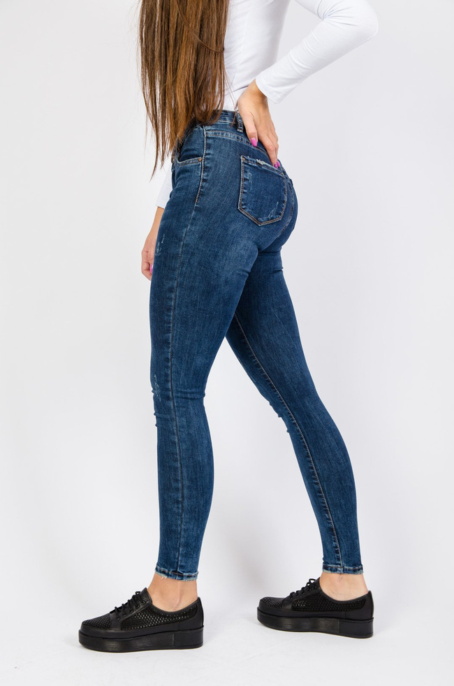 Ciemne spodnie jeansowe z przetarciami