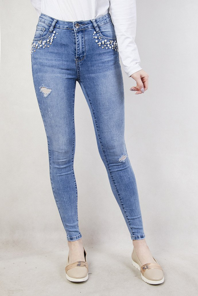 Jasne spodnie z koralikami przy kieszeni