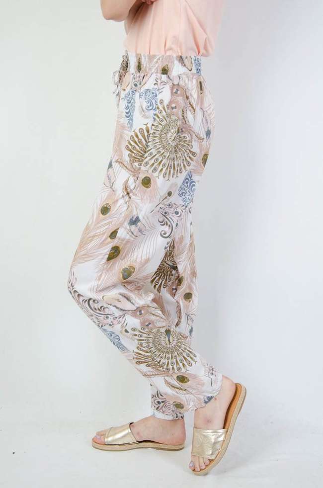 Białe spodnie alladynki z motywem pawiego oka
