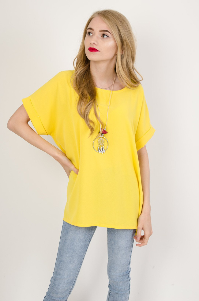 Żółta bluzka z guzikami na plecach