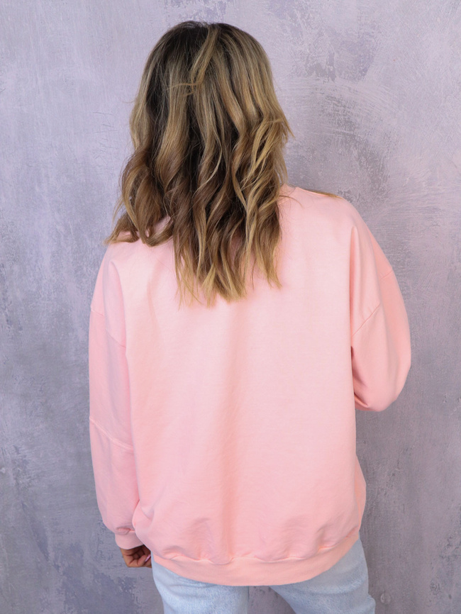 ASYMETRYCZNA BLUZA OVERSIZE Z PRZESZYCIAMI NA RĘKAWACH- JASNY ROŻ
