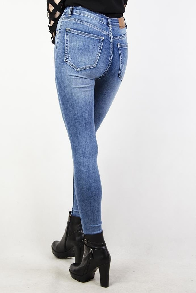 Jeansowe spodnie skinny jeans z przetarciami oraz wysokim stanem