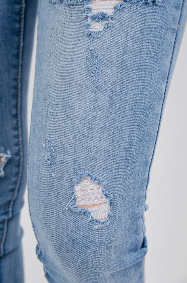 Jasne spodnie jeansowe Push up z przetarciami