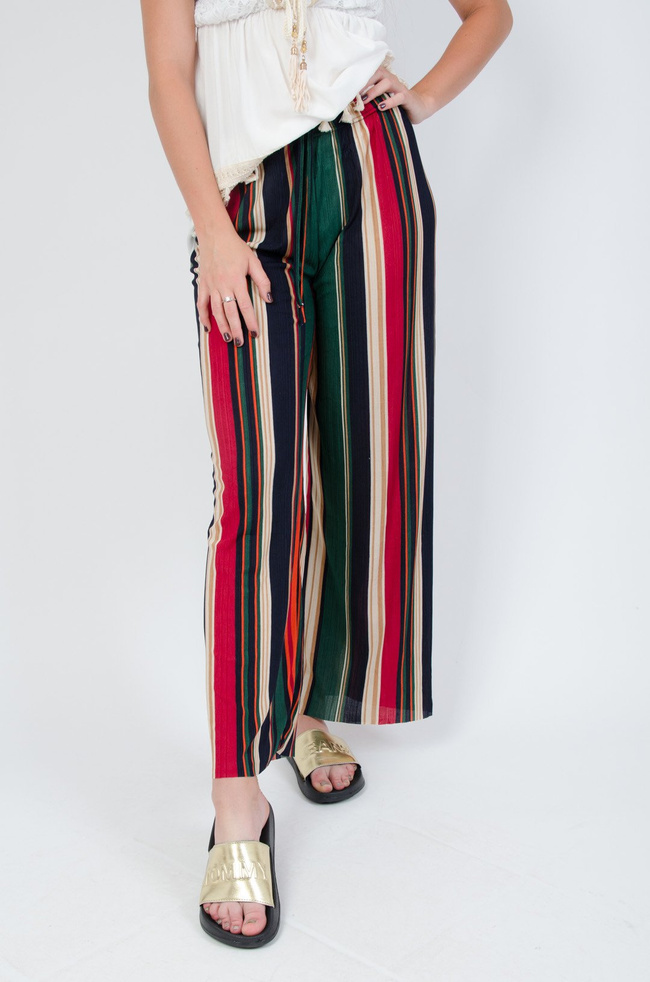 Kolorowe spodnie w paski z rozszerzanymi nogawkami