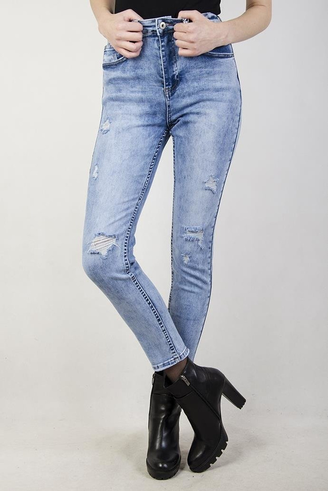 Jasne spodnie jeansowe z przetarciami i cieniowaniem