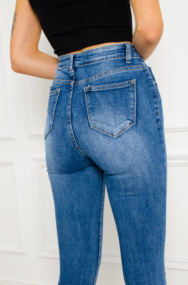 SPODNIE JEANSOWE SKINNY Z PRZETARCIAMI NA DOLE NOGAWKI- WYSOKI STAN
