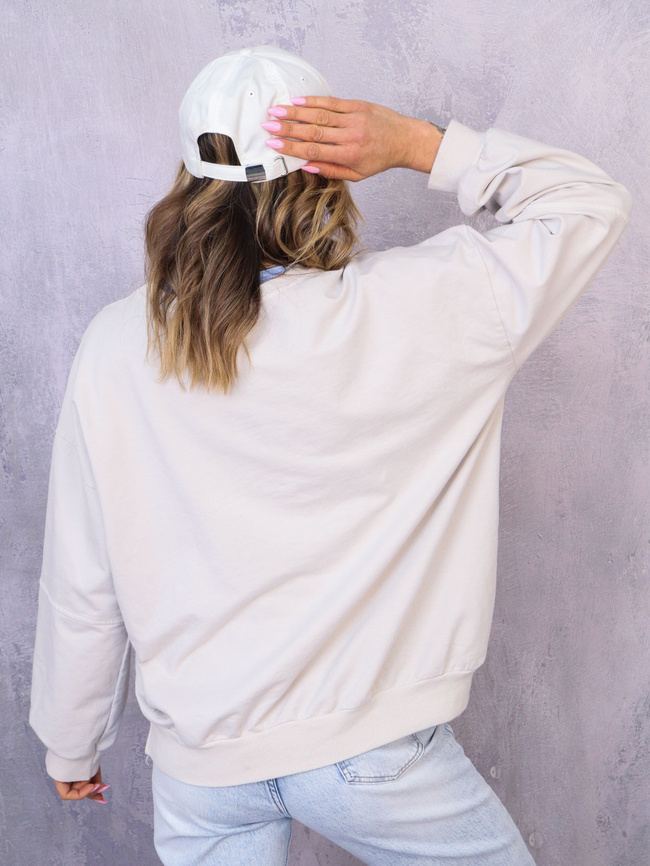 ASYMETRYCZNA BLUZA OVERSIZE Z PRZESZYCIAMI NA RĘKAWACH- BEŻOWA