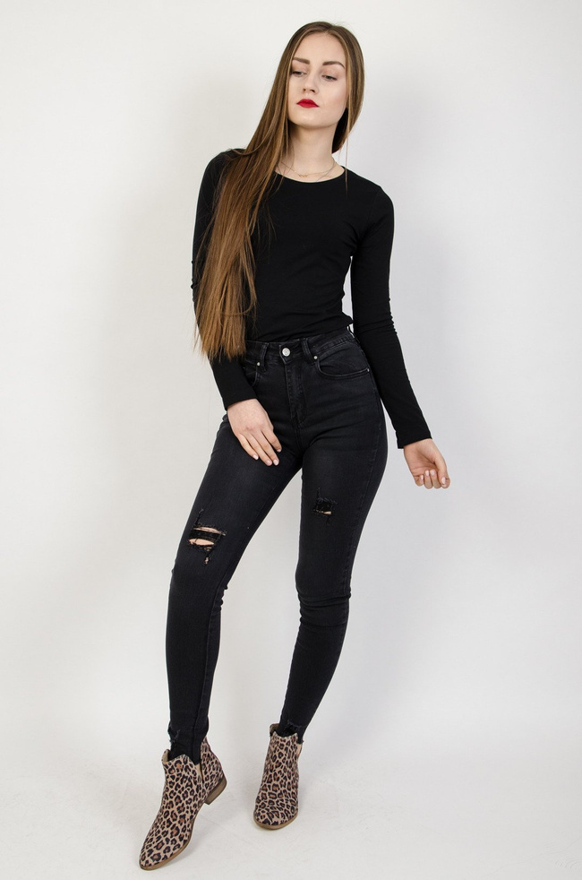 Ciemne spodnie jeansowe z przetarciami