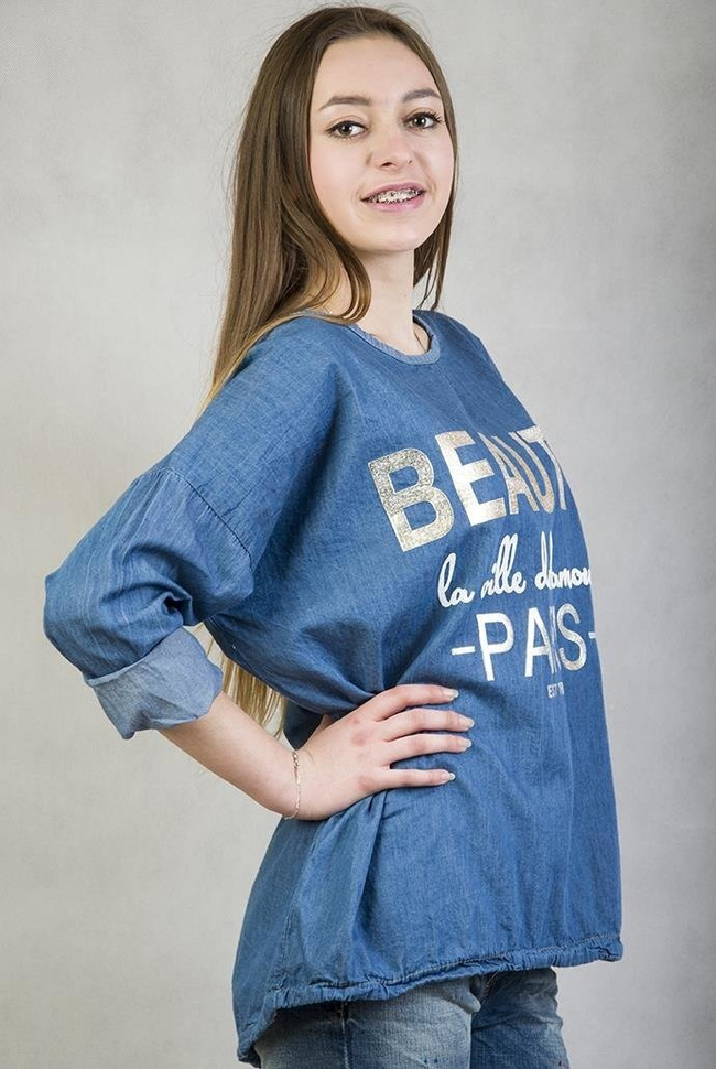 Jasno niebieska, asymetryczna bluzka jeansowa