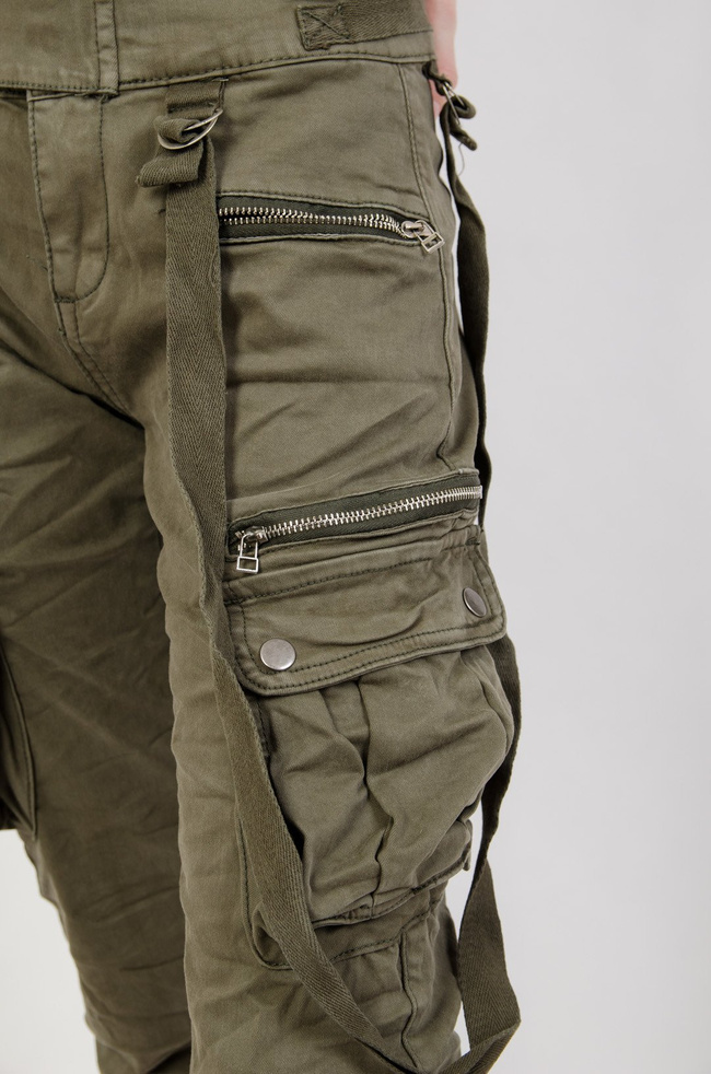 Zielone spodnie joggery z zamkami oraz szelkami