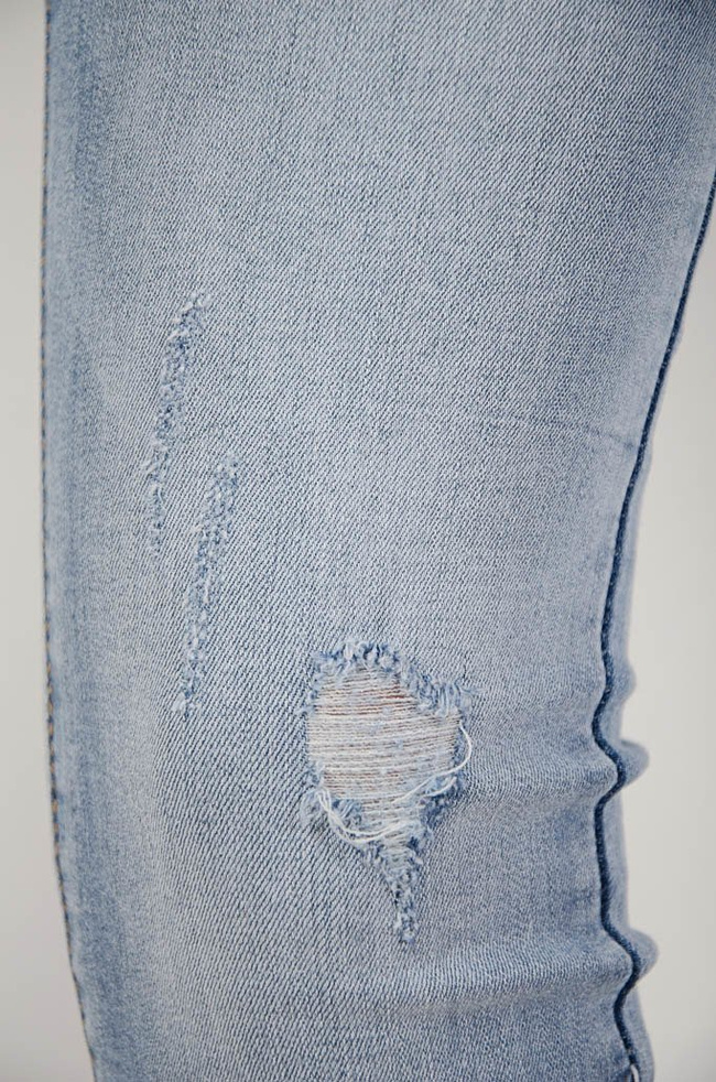 (Duże rozmiary L-XXXXL) Spodnie jeansowe z przetarciami