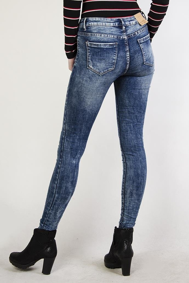 Spodnie jeansowe z zamkami, pogniecione przy nogawkach