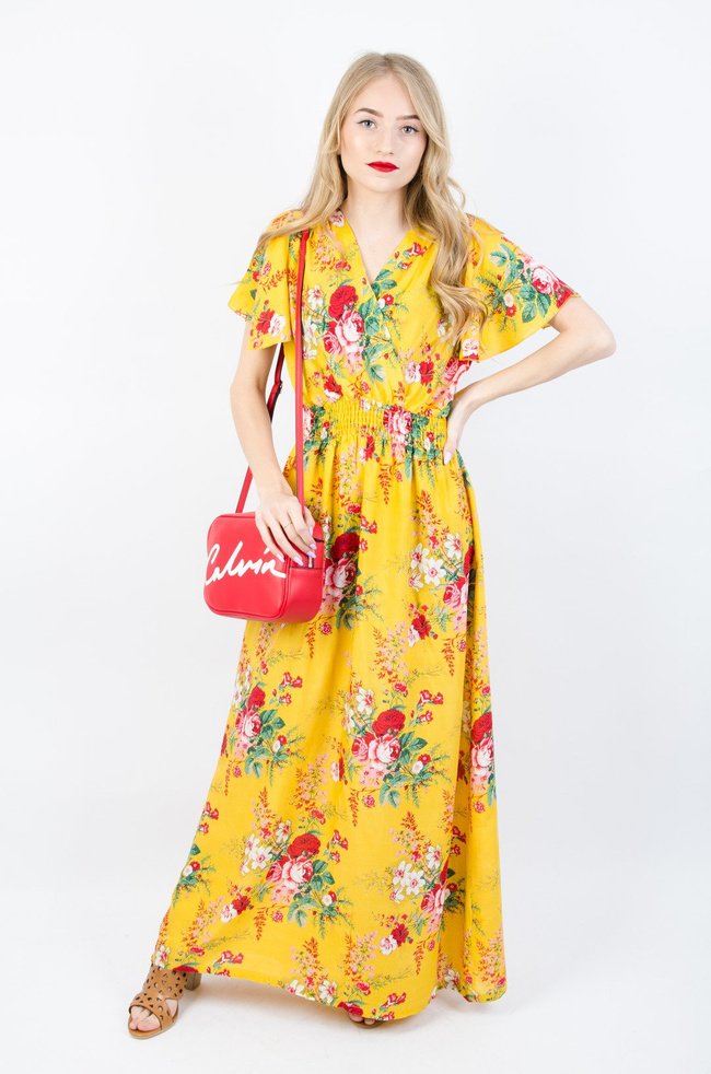 Żółta długa sukienka w kwiaty z gumą w pasie