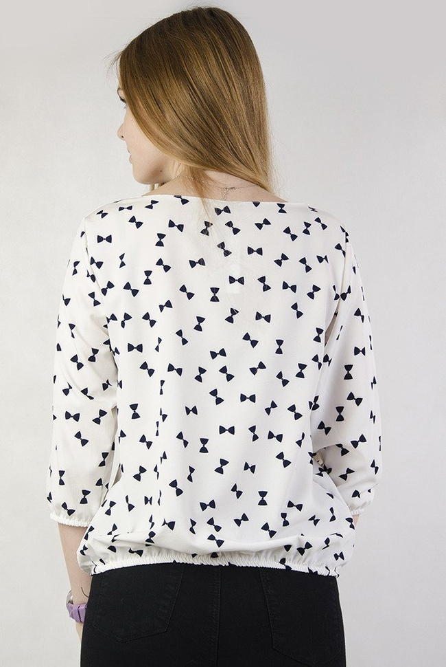 Biała bluzka w czarne kokardki