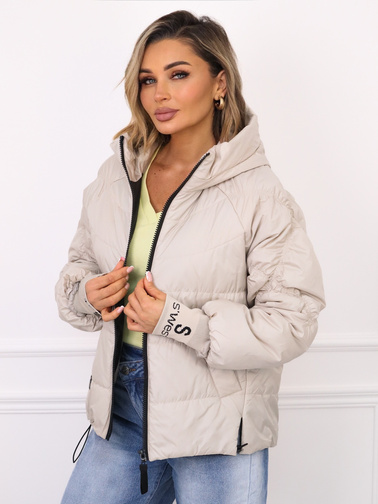 KURTKA Z OZDOBNYMI PRZESZYCIAMI NA RĘKAWACH I PRZEDŁUŻANYM ŚCIĄGACZEM- JASNOBEŻOWA