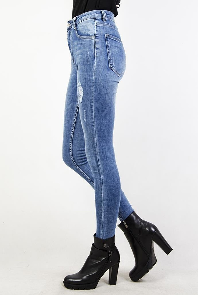 Jeansowe spodnie skinny jeans z przetarciami oraz wysokim stanem