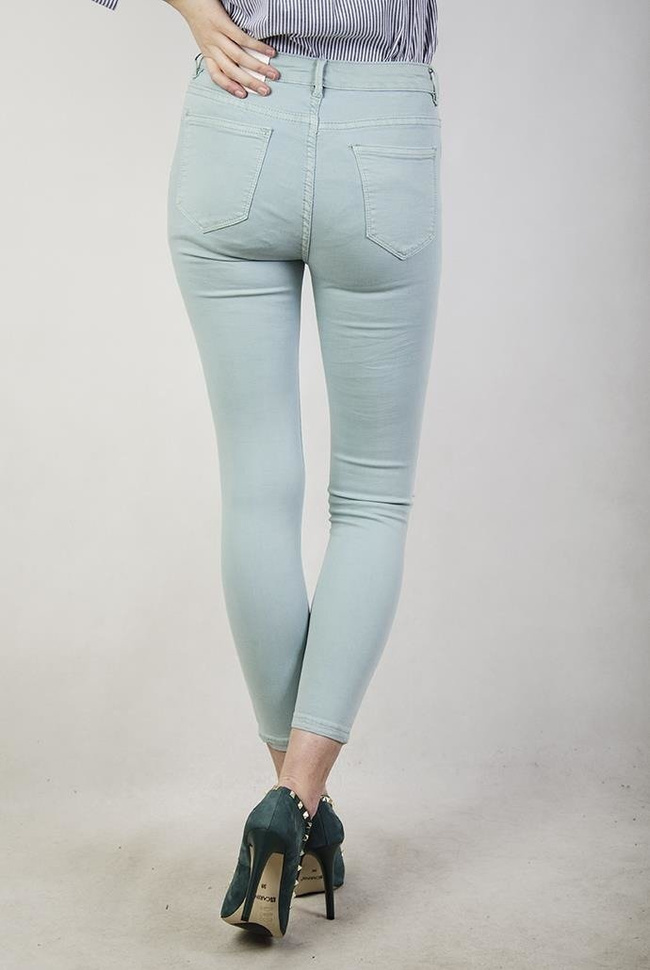 Jasnozielone spodnie jeansowe z wycięciami i wysokim stanem