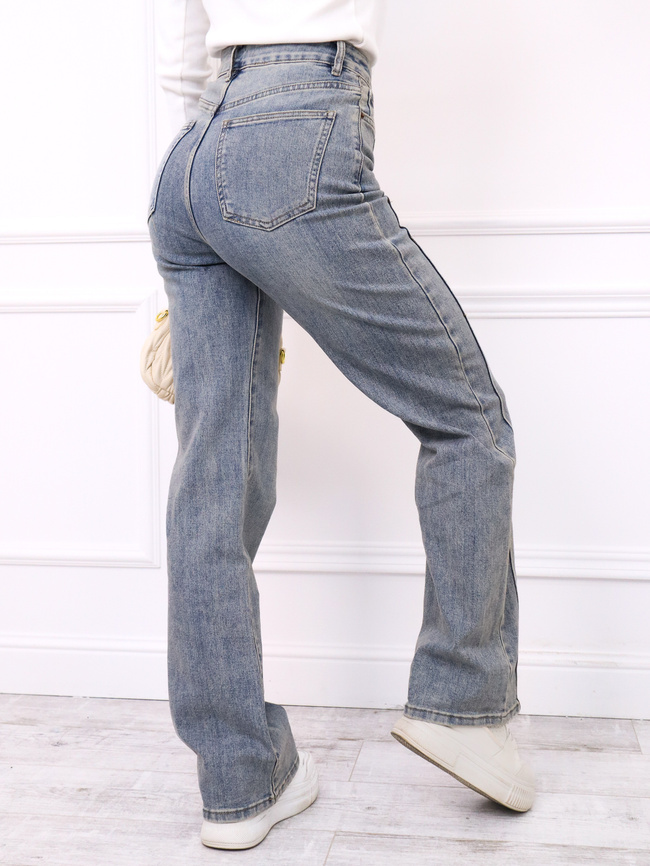 SPODNIE JEANSOWE Z PRZESZYCIAMI NA NOGAWKACH- NIEBIESKIE