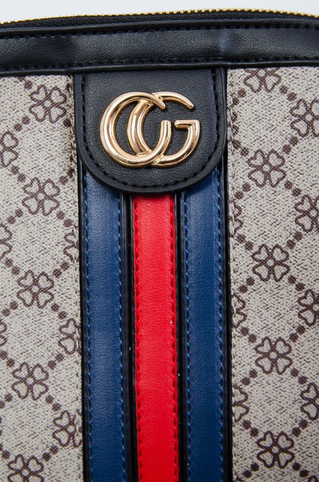 Wzorzysta torebka z czerwono-granatowym paskiem na przodzie