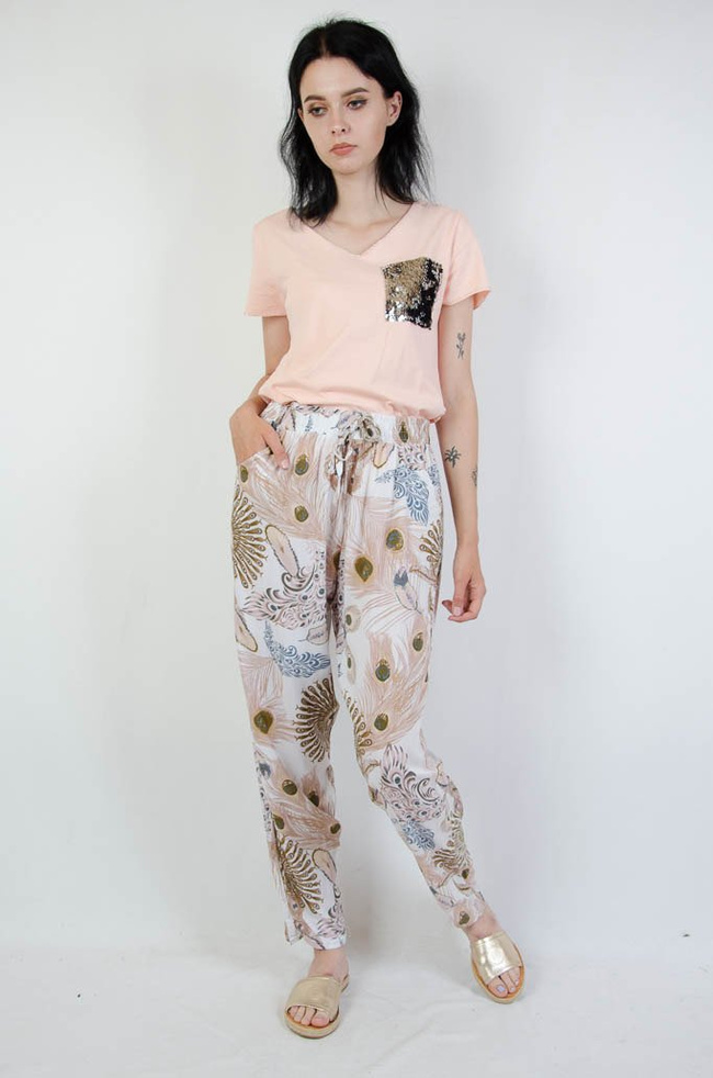 Białe spodnie alladynki z motywem pawiego oka