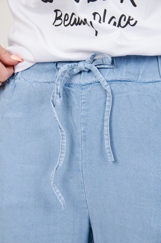 Niebieskie spodnie materiałowe z lampasami 