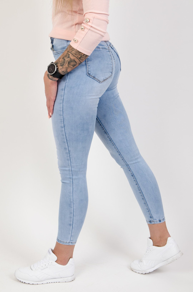 Jasne spodnie jeansowe push up z delikatnymi przetarciami