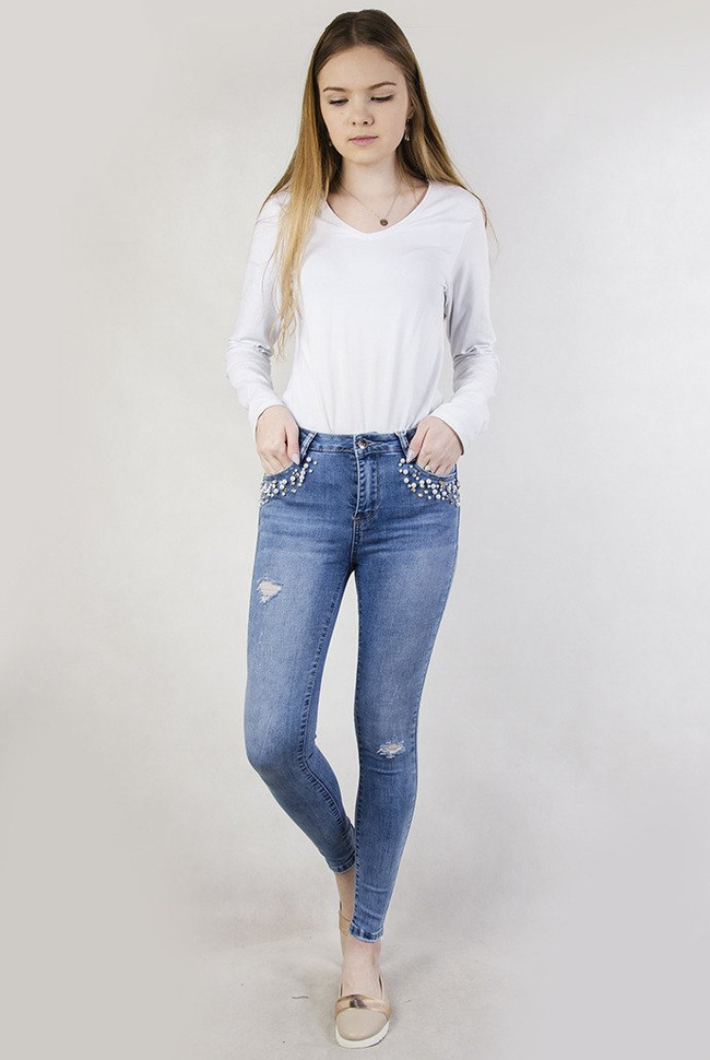 Jasne spodnie z koralikami przy kieszeni