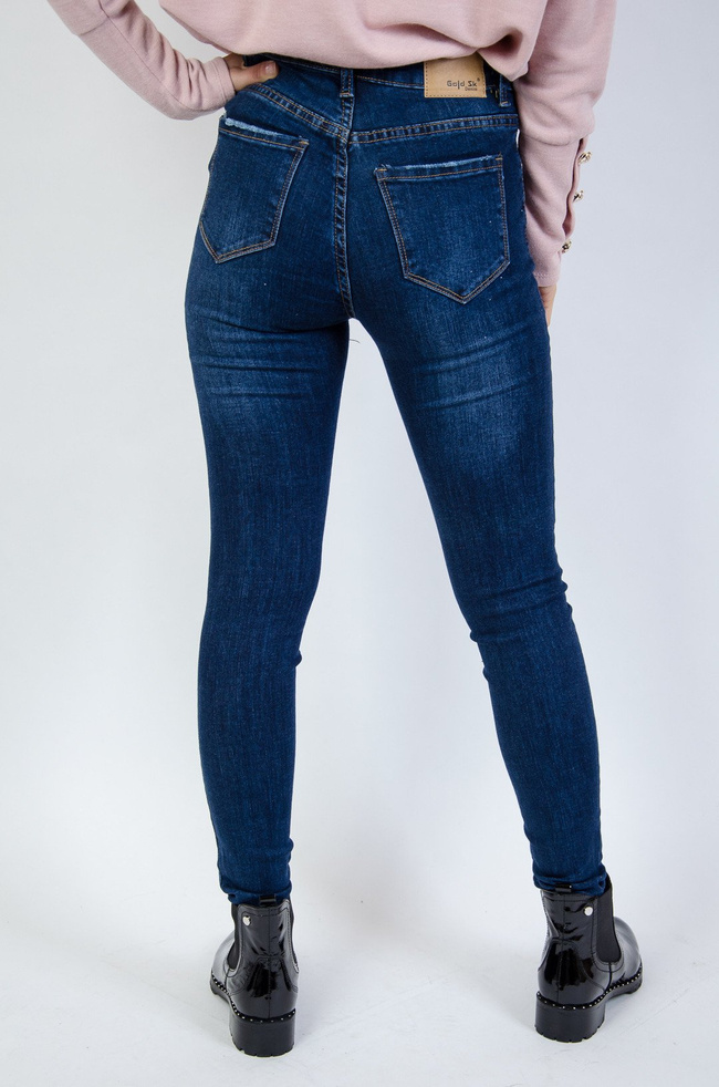 Jeansowe przylegające spodnie z przetarciami