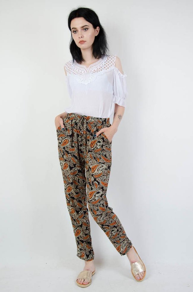 Długie spodnie alladynki w pomarańczowe wzory