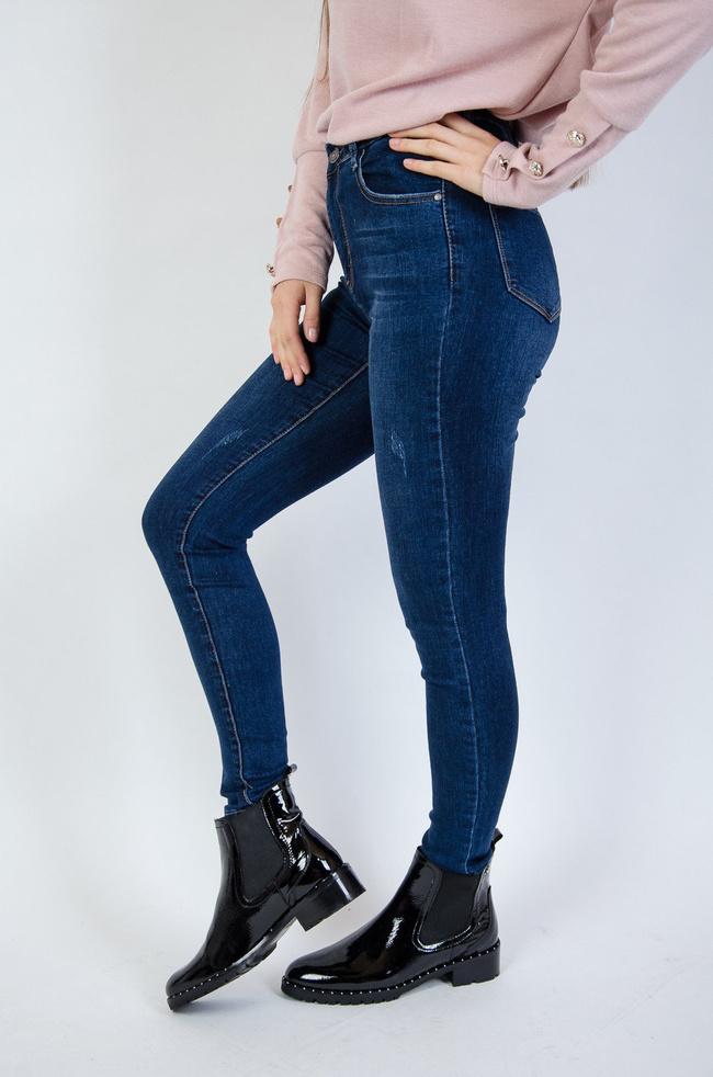 Jeansowe przylegające spodnie z przetarciami