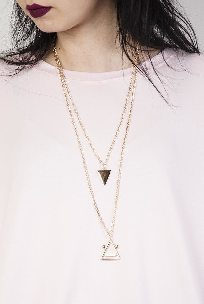 Jasnoróżowa tunika z kieszonkami i wisiorkiem