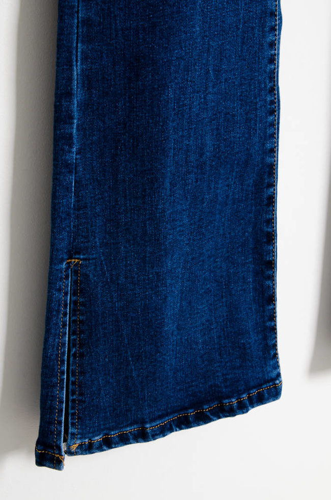 NIEBIESKIE SPODNIE JEANSOWE DZWONY Z ROZCIĘCIEM